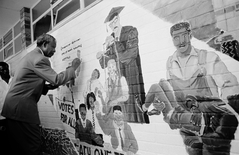 Nelson Mandela signs mural at the Alexander Sinton Secondary School, 1992