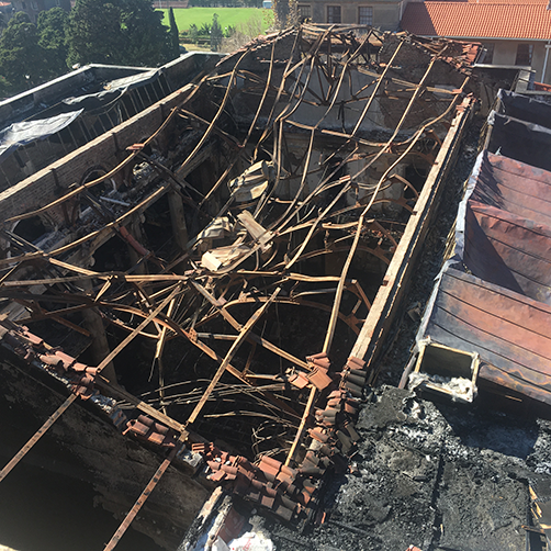 View of roof trusses of the burnt Jagger Library Reading Room